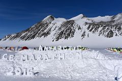 02C Ice Sign For The Antarctica Marathon 2016 At Union Glacier Antarctica With Mount Rossmann Beyond.jpg